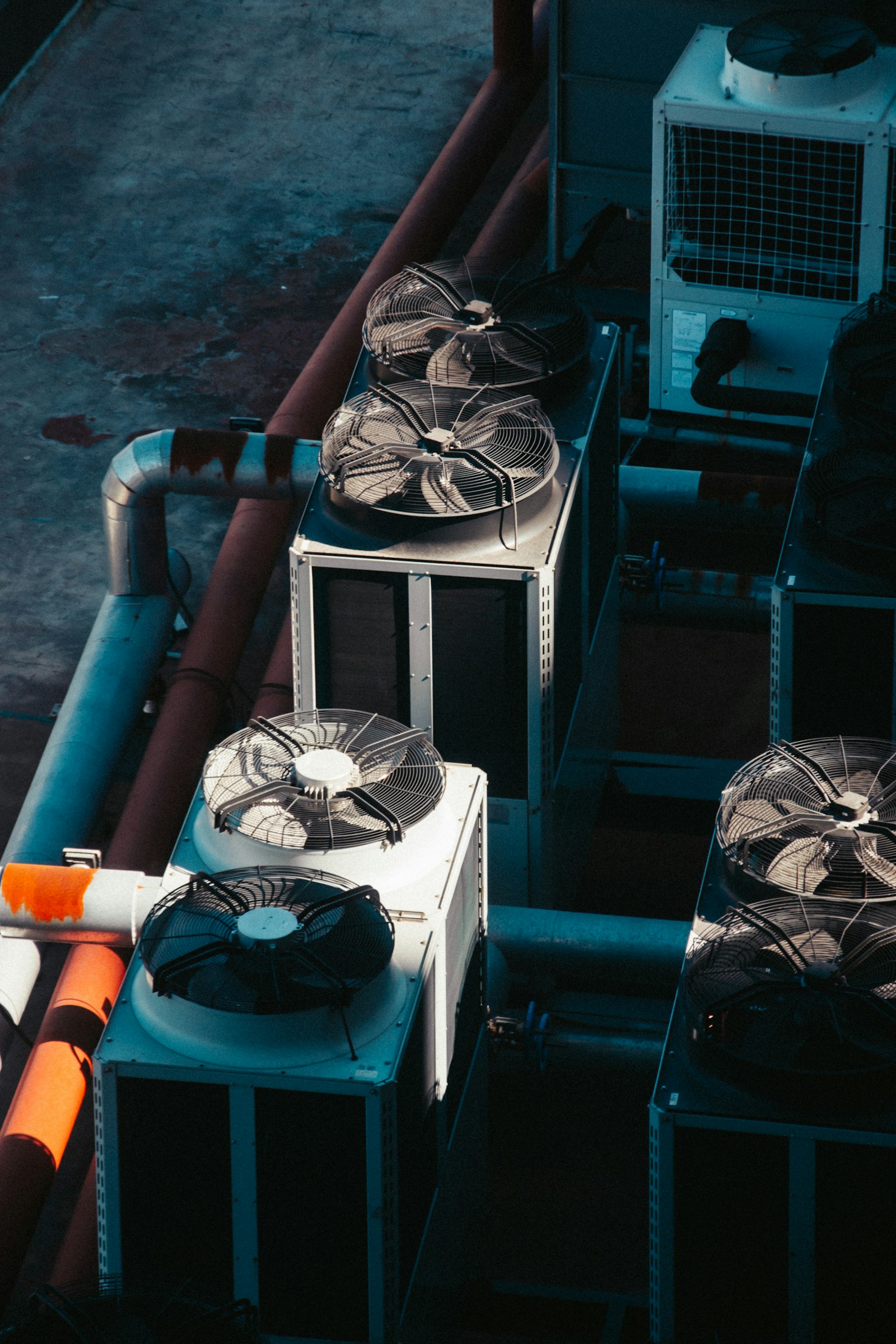 Rows of industrial cooling units on a rooftop